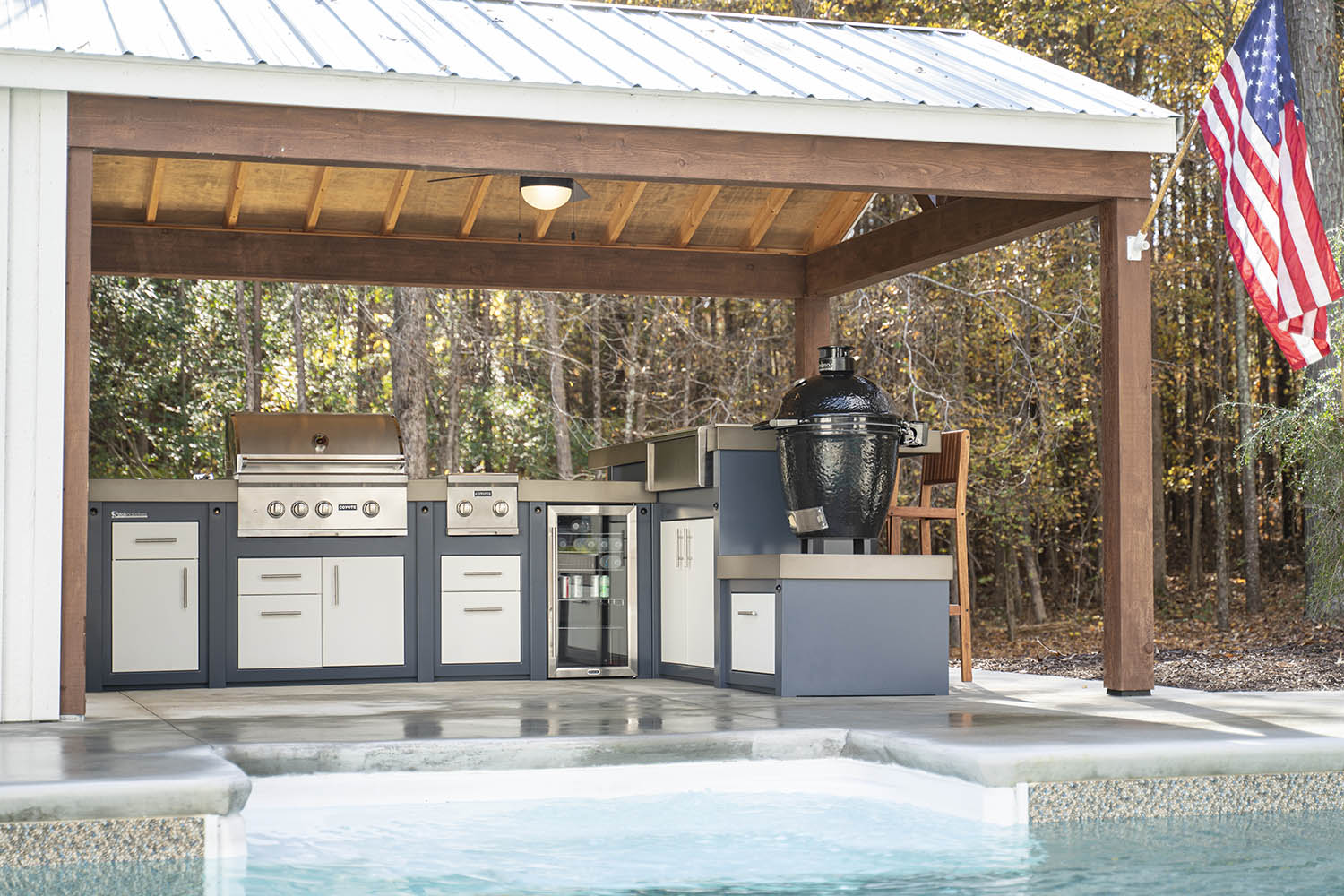 outdoor kitchen design by pool