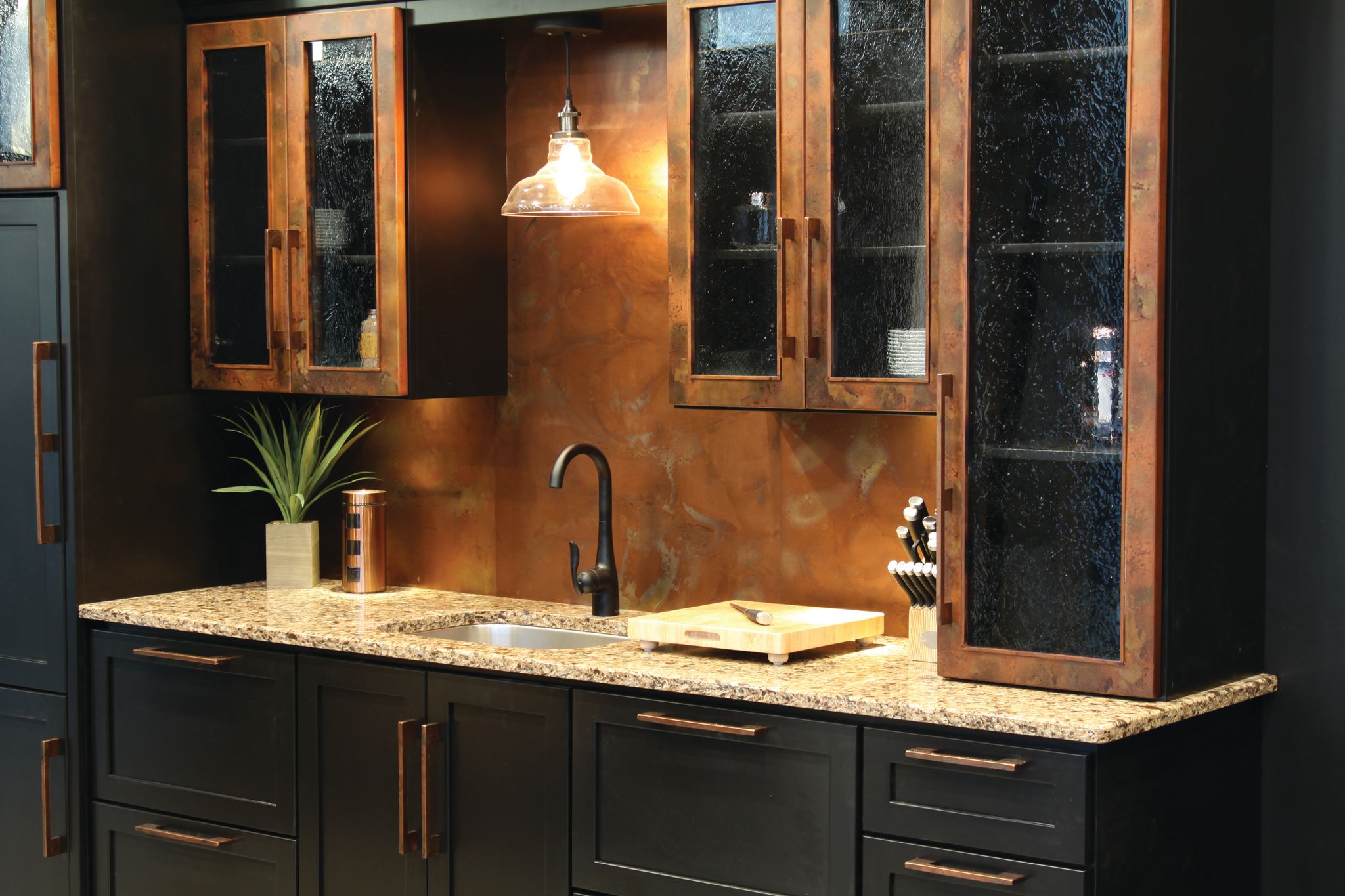 A metal cabinet in a darker style with an aged copper finish.