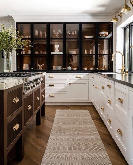A kitche from Precison Cabinetry & Design showcasing stainless steel kitchen cabinets.